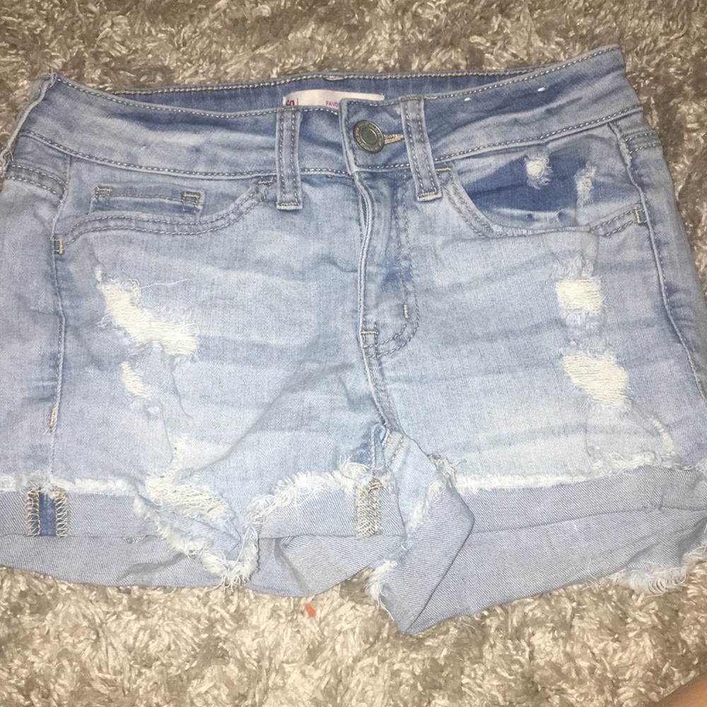 Ripped blue jean shorts